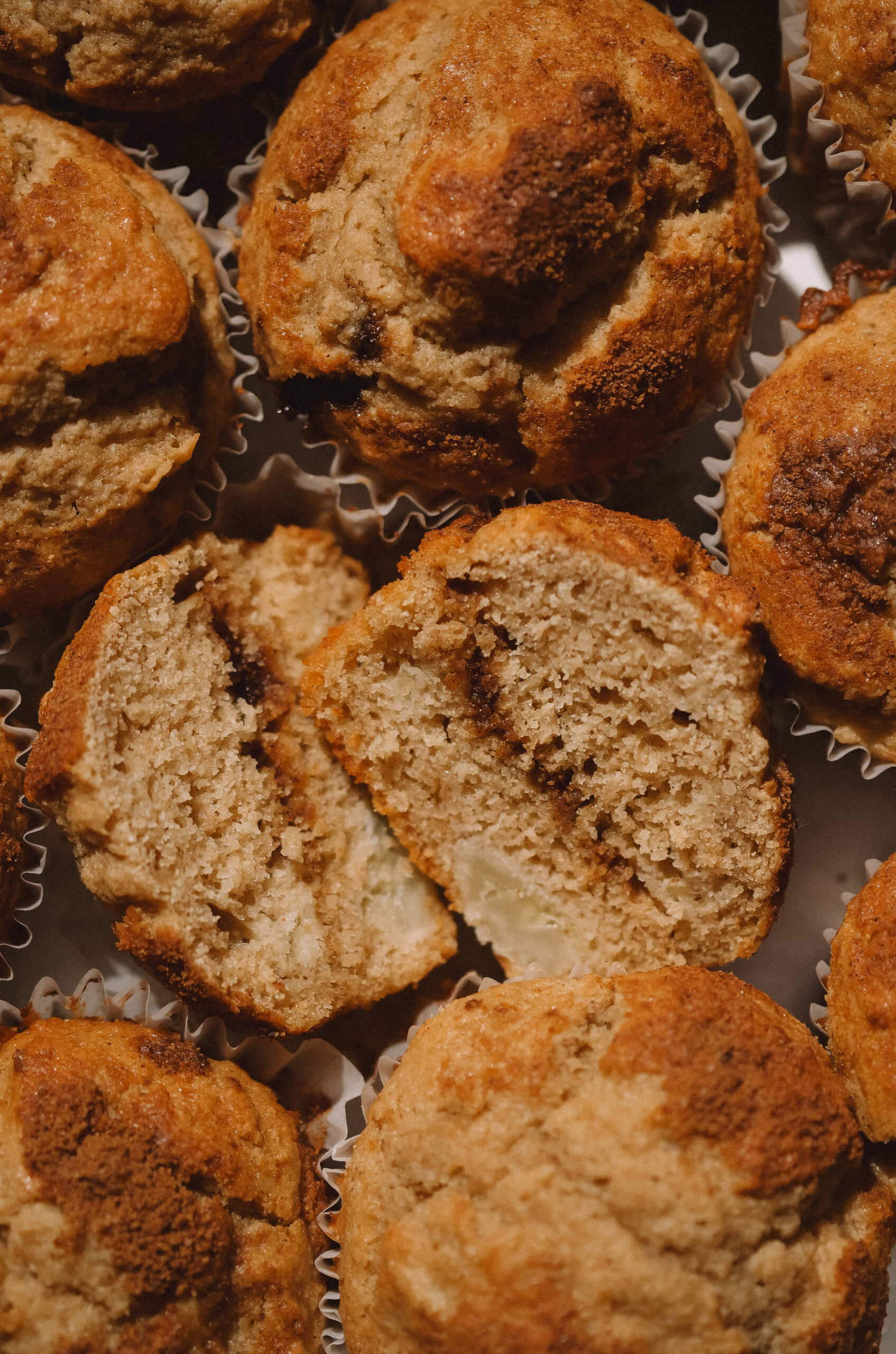 Nine brown banana muffins with cinnamon sugar filling